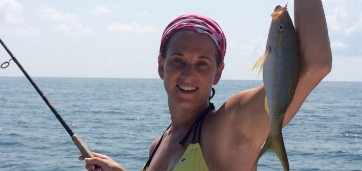 Melissa holding her yellowtail snapper caught off Marathon in the Fl Keys.