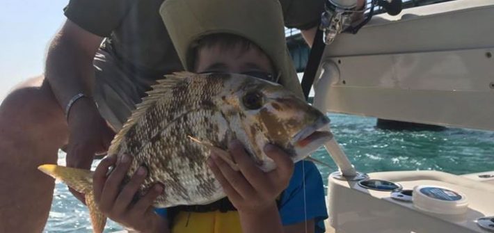 Porgy for my little French buddy. Take your kid fishing with Capt Doug!