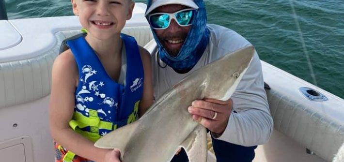 My lil buddy got his first shark today! This made for a special trip for a 7 yea…