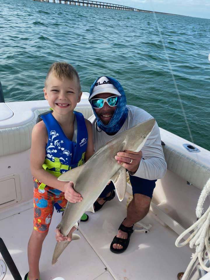 My lil buddy got his first shark today! This made for a special trip for a 7 yea…